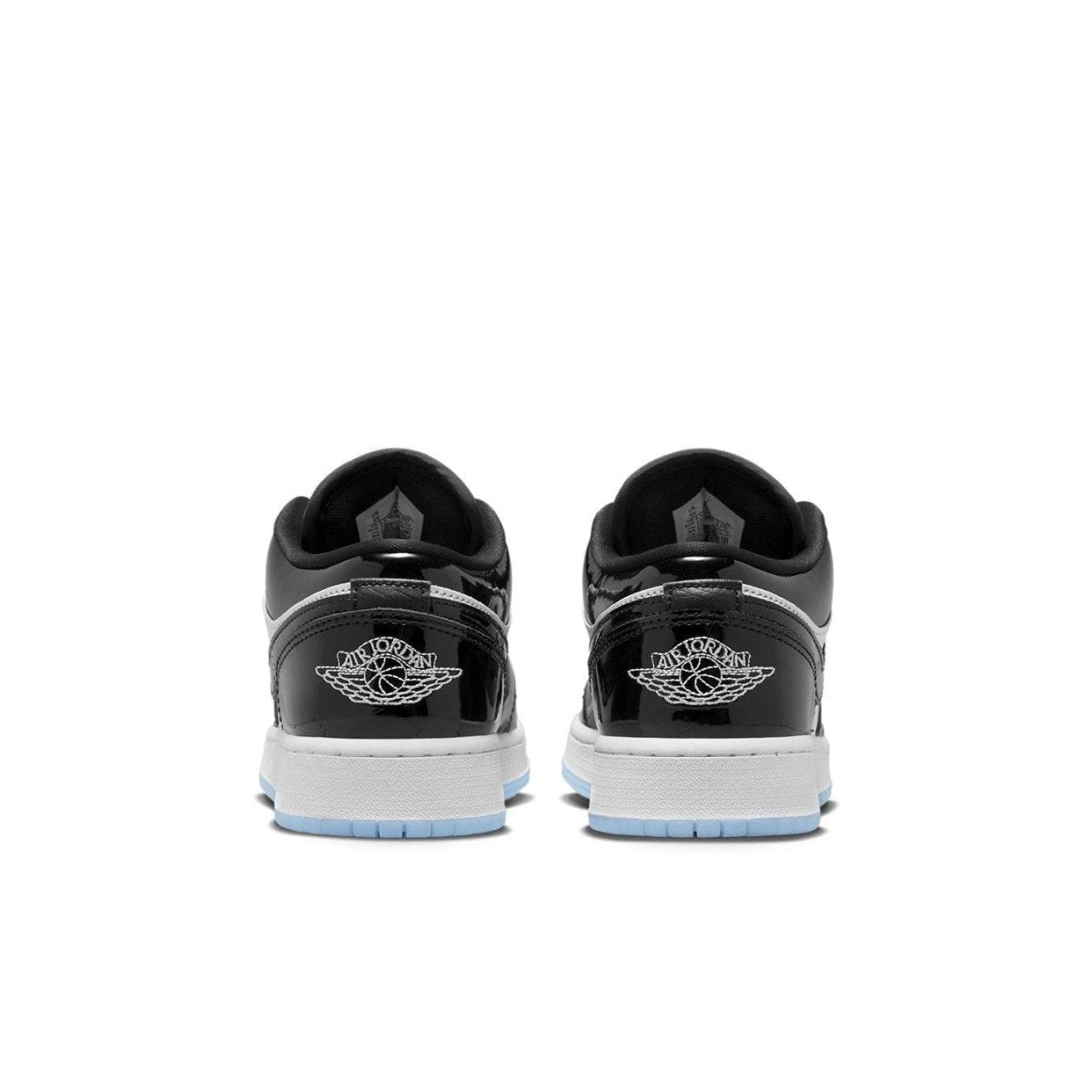 Retro Air Jordan 1 Low SE Concord GS shoes featuring sleek black patent overlays and classic logo detail on the heel.