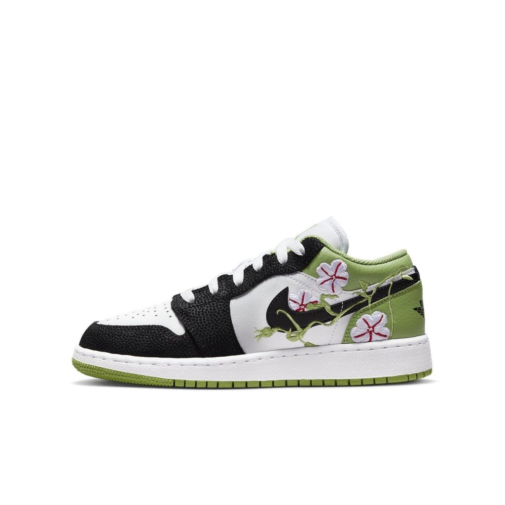 Jordan 1 Low SE Floral Vines sneaker featuring white leather, black overlays, and floral designs on the Swoosh.