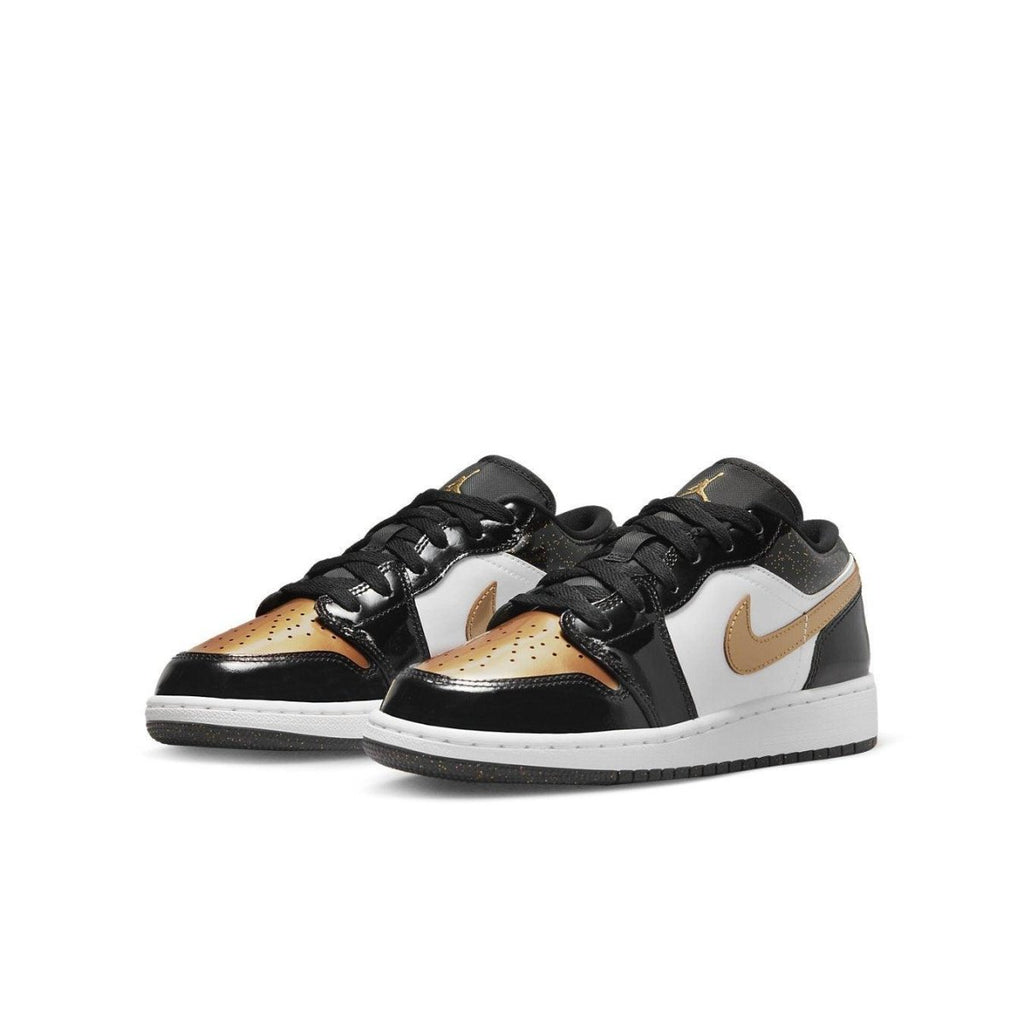 Jordan 1 Low SE Gold Toe GS sneakers in black, gold, and white with patent leather finish.