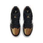 Jordan 1 Low SE Gold Toe (GS) sneaker featuring black, gold, and white colorway with perforated gold toe.
