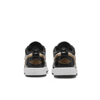 Retro Jordan 1 Low SE Gold Toe sneakers featuring black, gold, and white colorway from the back view.