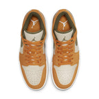 Top view of Air Jordan 1 Low SE Light Curry with orange and olive suede accents on a beige canvas base.