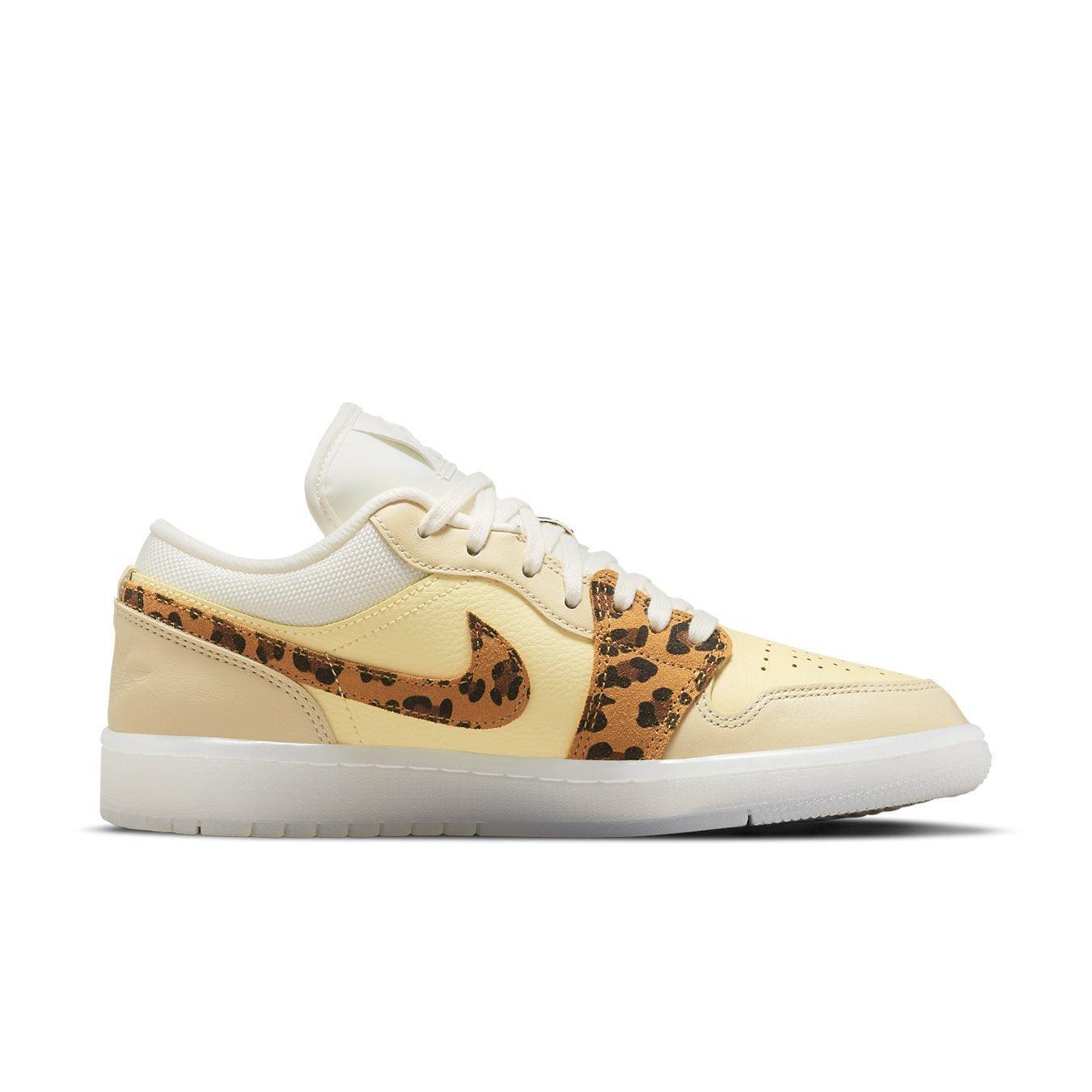 Nike Air Jordan 1 Low SNKRS Day women's sneaker featuring yellow leather and leopard print accents.