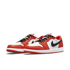 Air Jordan 1 Low OG Starfish featuring white leather, orange accents, and black Swoosh.