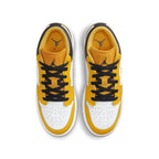 Top view of Air Jordan 1 Low Taxi GS sneakers in black, white, and gold colorway.