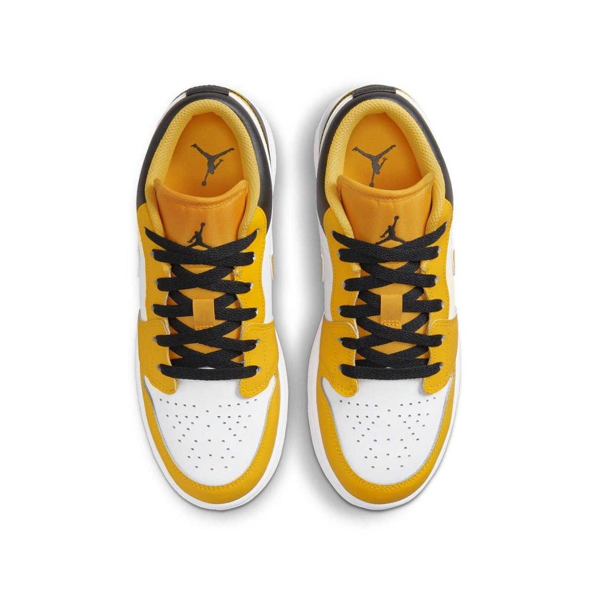 Top view of Air Jordan 1 Low Taxi GS sneakers in black, white, and gold colorway.