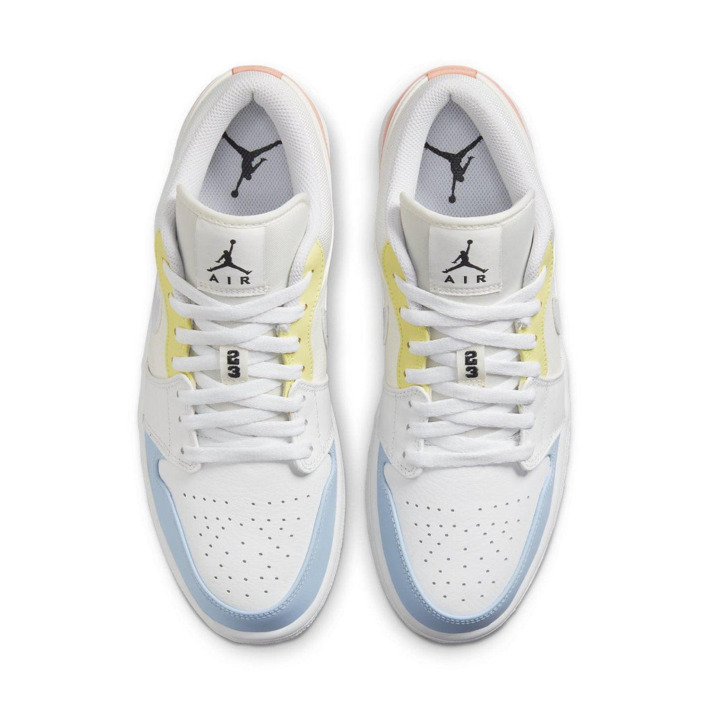 Jordan 1 Low To My First Coach sneakers in white with yellow and blue accents, featuring classic Jumpman logo on tongue.