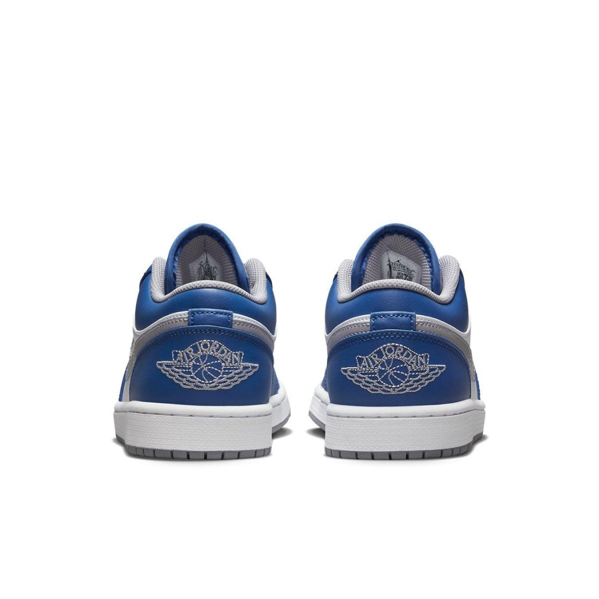 Retro Air Jordan 1 Low True Blue sneakers featuring white, blue, and grey colorway with iconic logo on heel.