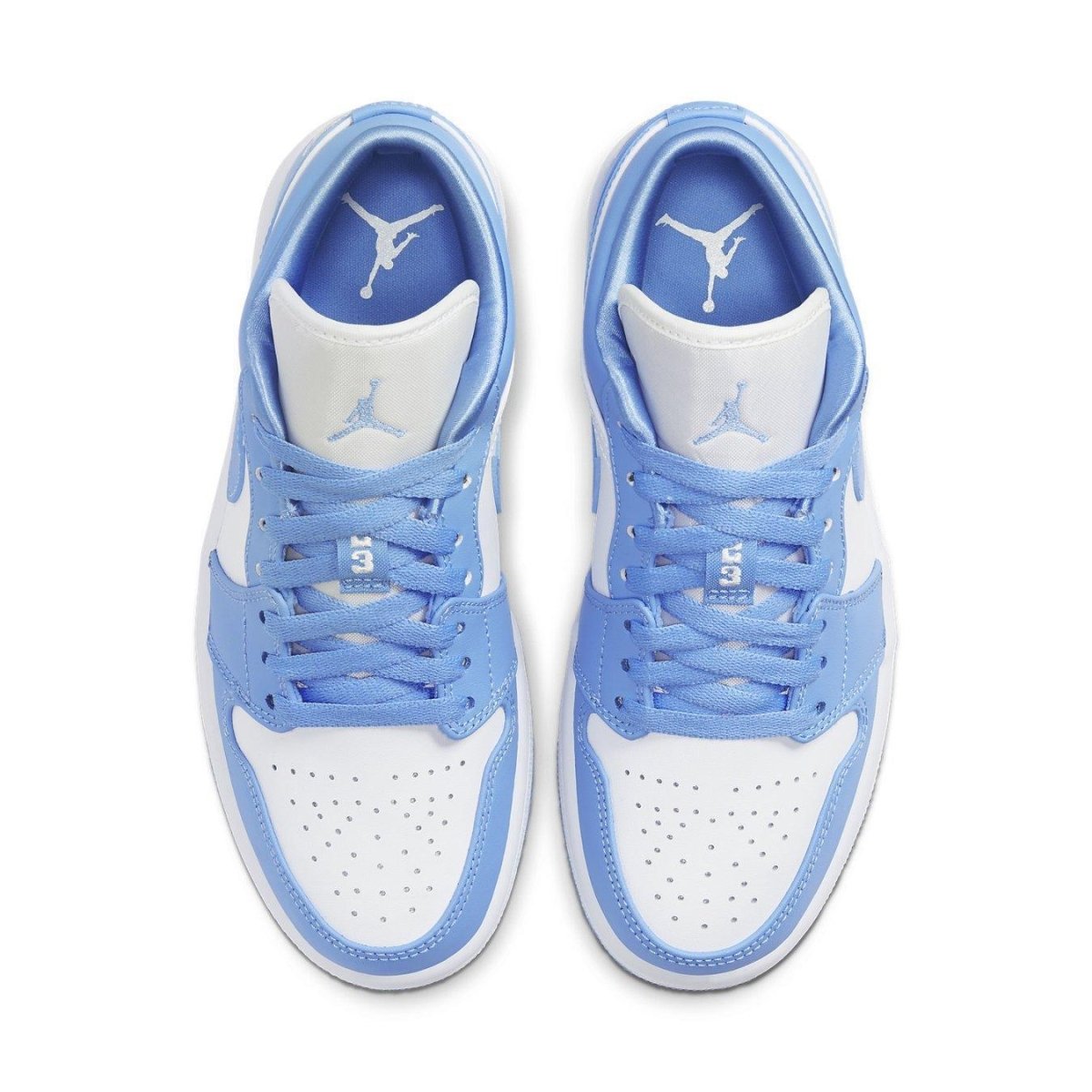 Air Jordan 1 Low UNC Women's sneakers featuring University Blue and white color scheme, perforated toe box, and padded collar.