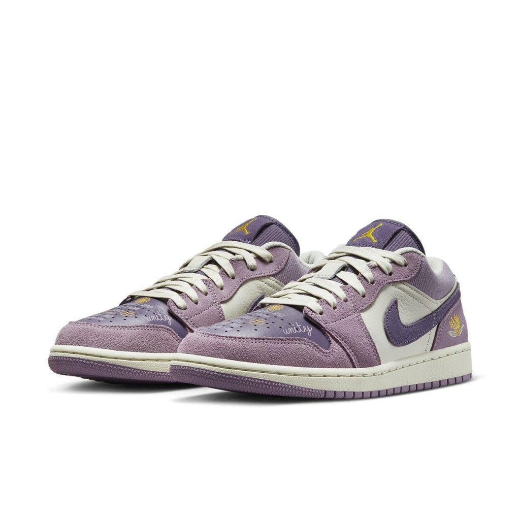 Air Jordan 1 Low Unity (W) in purple and white, featuring suede and leather materials to celebrate unity.