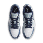 Top view of Jordan 1 Low Washed Denim sneakers with white canvas and blue denim accents.