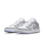 Air Jordan 1 Low Wolf Grey sneakers featuring premium white and grey leather design.
