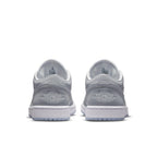 Rear view of the Jordan 1 Low Wolf Grey sneakers showcasing premium leather and iconic OG Wings logo.