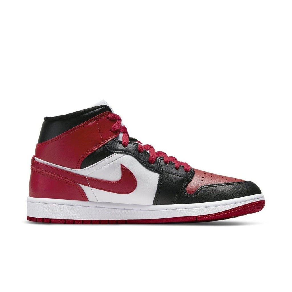 Nike Air Jordan 1 Mid WMNS Bred Toe sneakers in red, white, and black leather, featuring a classic design.