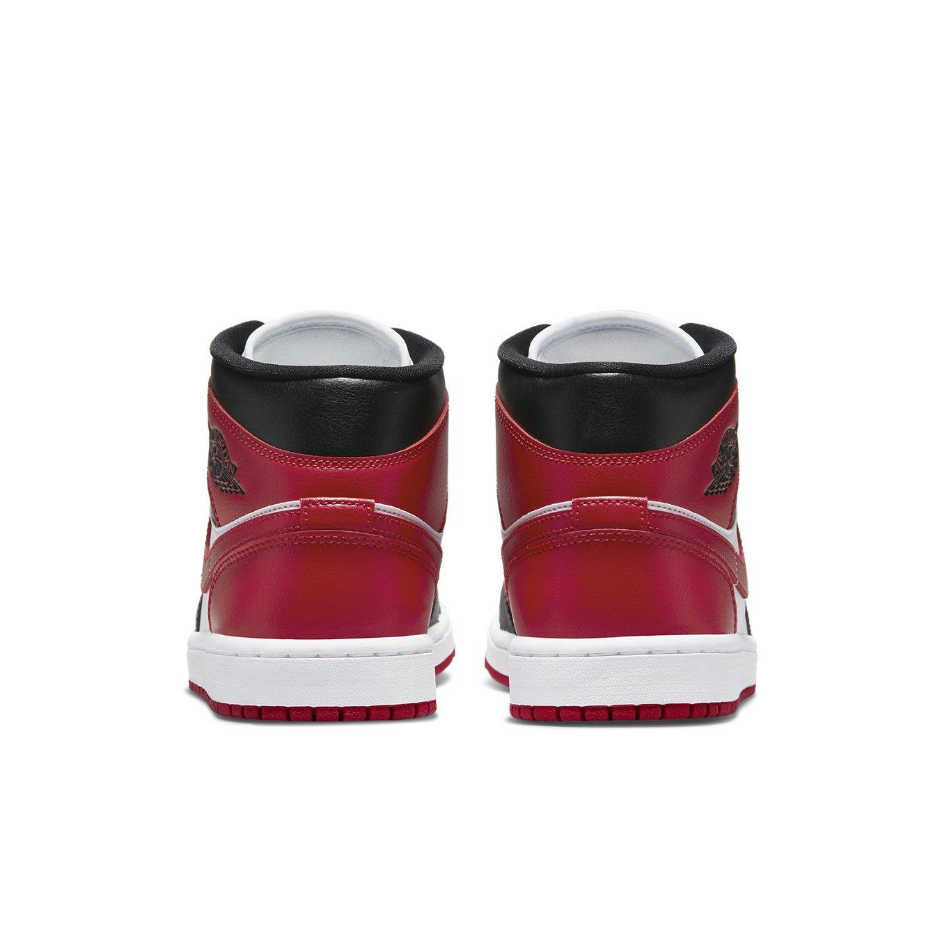 Retro Air Jordan 1 Mid WMNS Bred Toe shoes featuring red, white, and black leather design from behind.