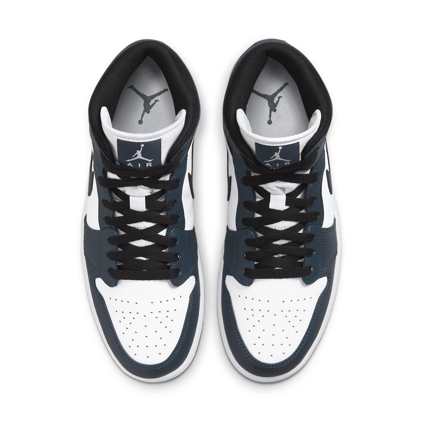 Top view of Jordan 1 Mid Armory Navy sneaker featuring suede and leather design in navy and white colors.
