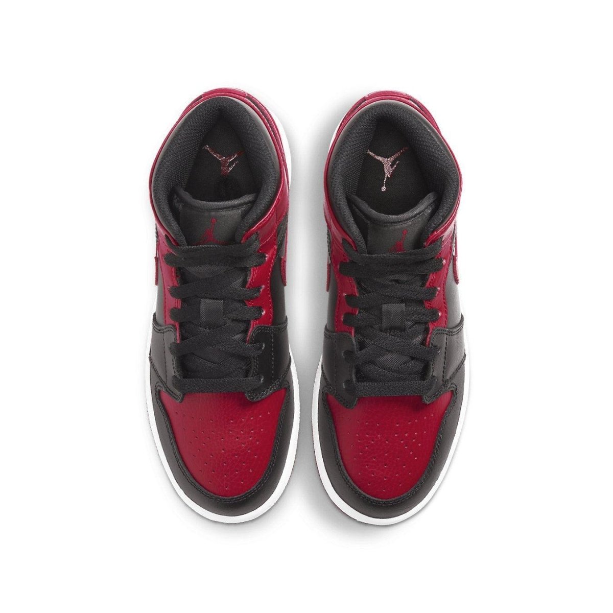 Top view of Air Jordan 1 Mid Banned 2020 GS sneakers, featuring black and red design with white sole.