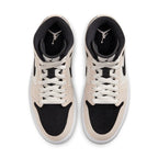 Air Jordan 1 Mid Barely Orange sneakers top view featuring beige and black design with white laces.