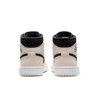 Rear view of Jordan 1 Mid Barely Orange women's sneakers showcasing the black and soft peach design with iconic branding.
