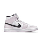 Women’s Nike Air Jordan 1 Mid 'Barely Rose' sneaker with white leather and black Swoosh detail.