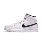 Air Jordan 1 Mid Barely Rose Women's sneaker in pink and white with black Swoosh and logo.