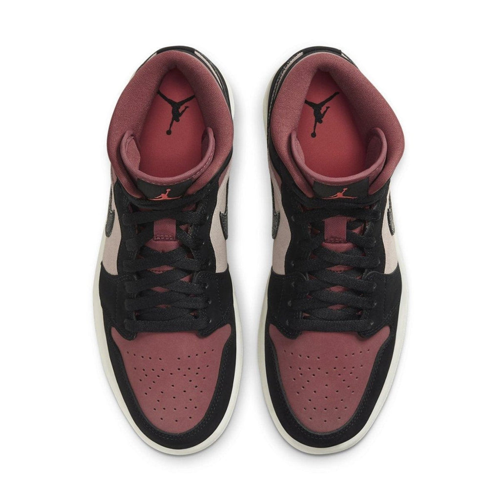Top view of Jordan 1 Mid Canyon Rust sneakers featuring burgundy, black, and pink color scheme.