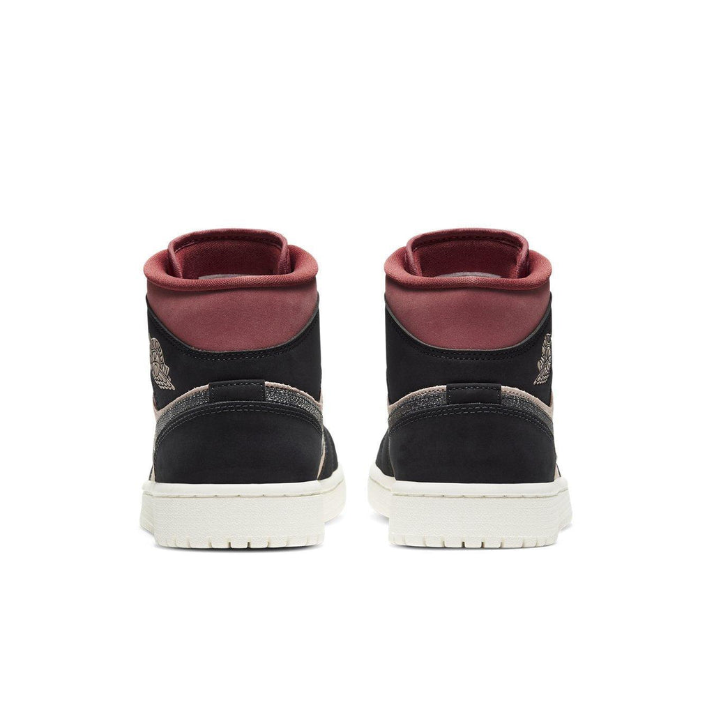 Air Jordan 1 Mid Canyon Rust women's sneakers showcasing black and coral nubuck rear view.