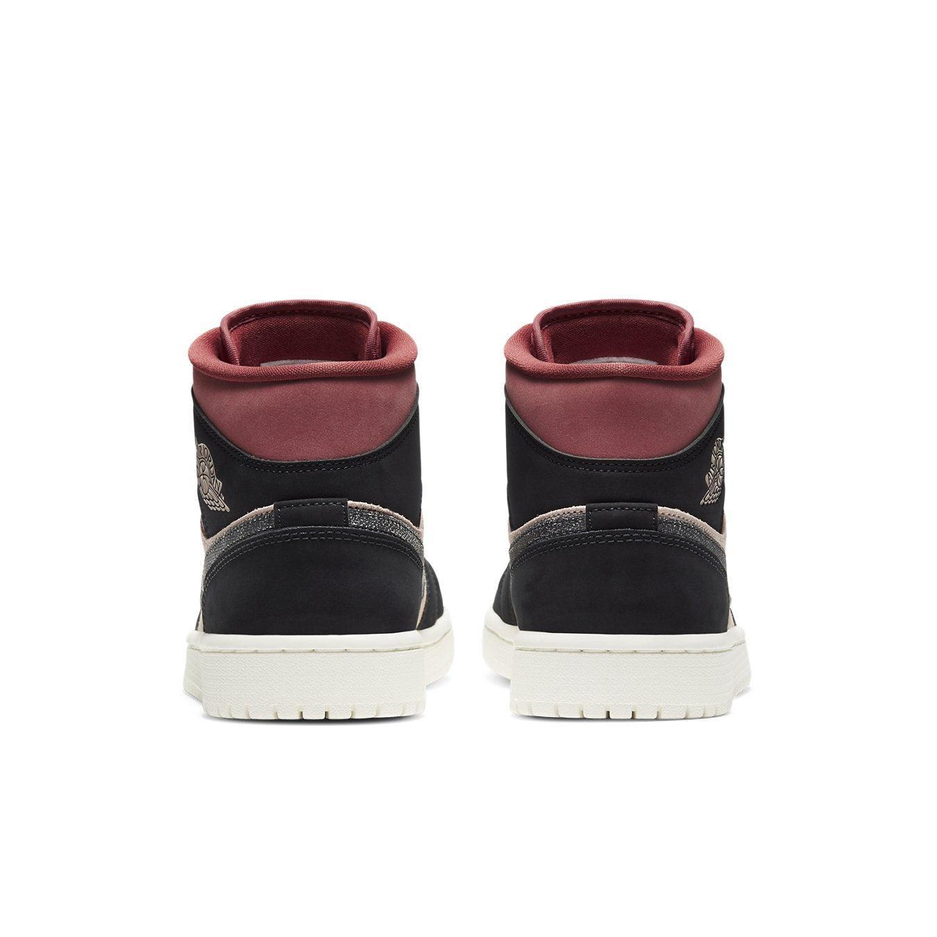 Air Jordan 1 Mid Canyon Rust women's sneakers showcasing black and coral nubuck rear view.