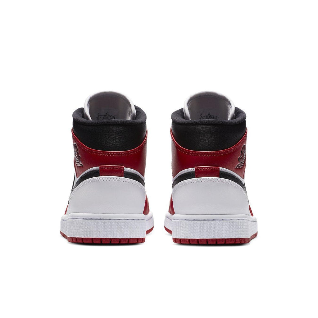 Back view of Jordan 1 Mid Chicago (2020) sneakers featuring red, black, and white leather design.