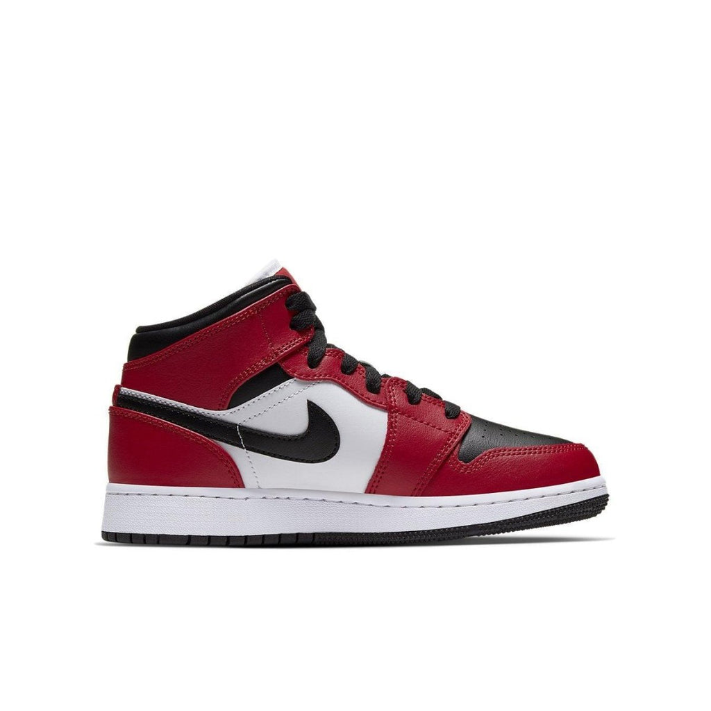 Air Jordan 1 Mid Chicago Black Toe (GS) sneakers in red, white, and black colorway, showcasing classic design.