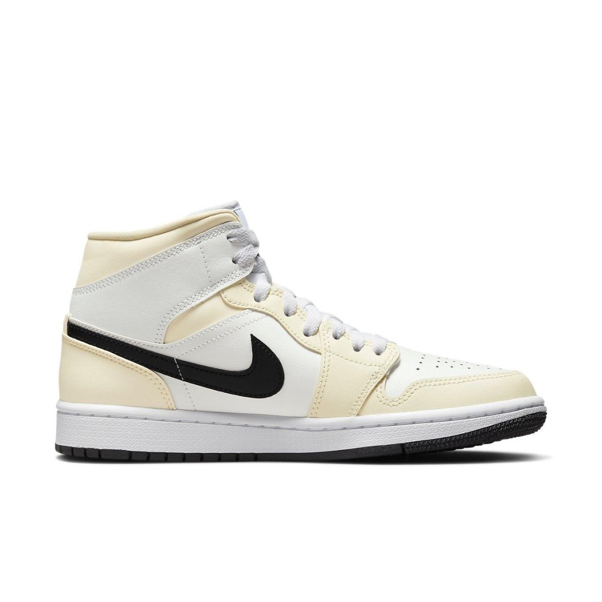 Nike Air Jordan 1 Mid Coconut Milk Women's sneakers featuring cream and white leather with black Swoosh.
