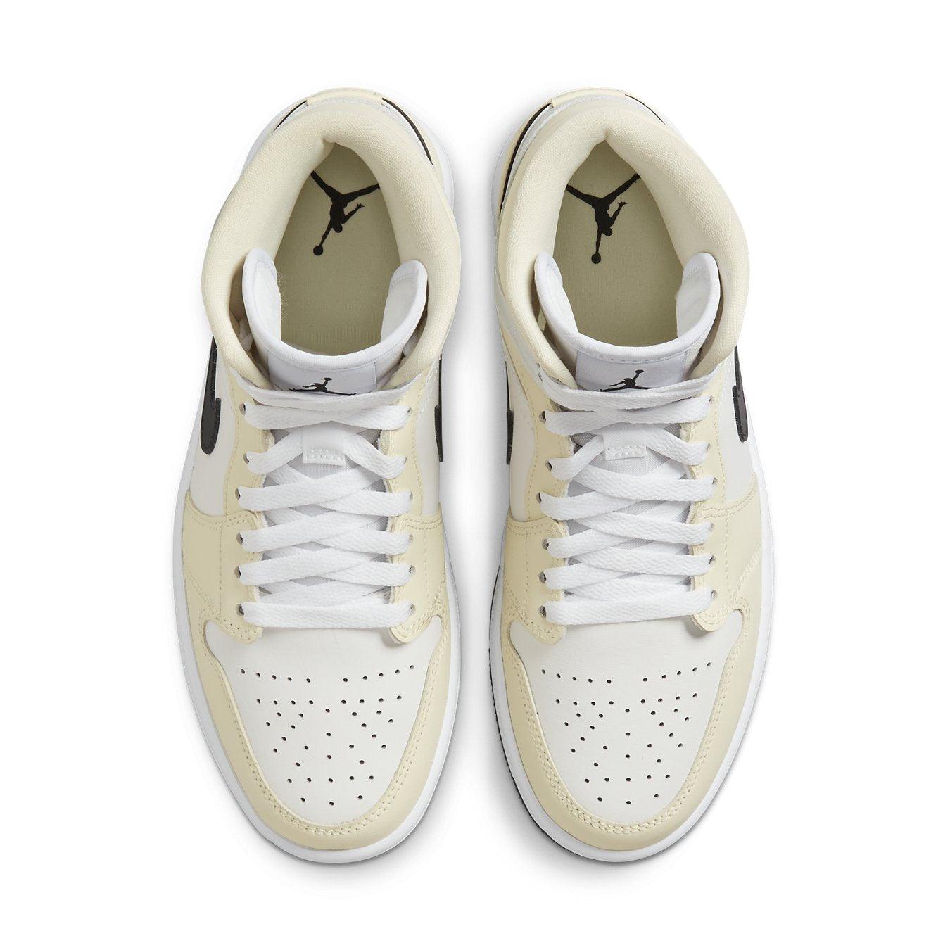 Top view of Air Jordan 1 Mid Coconut Milk women's sneakers with cream and white tones.