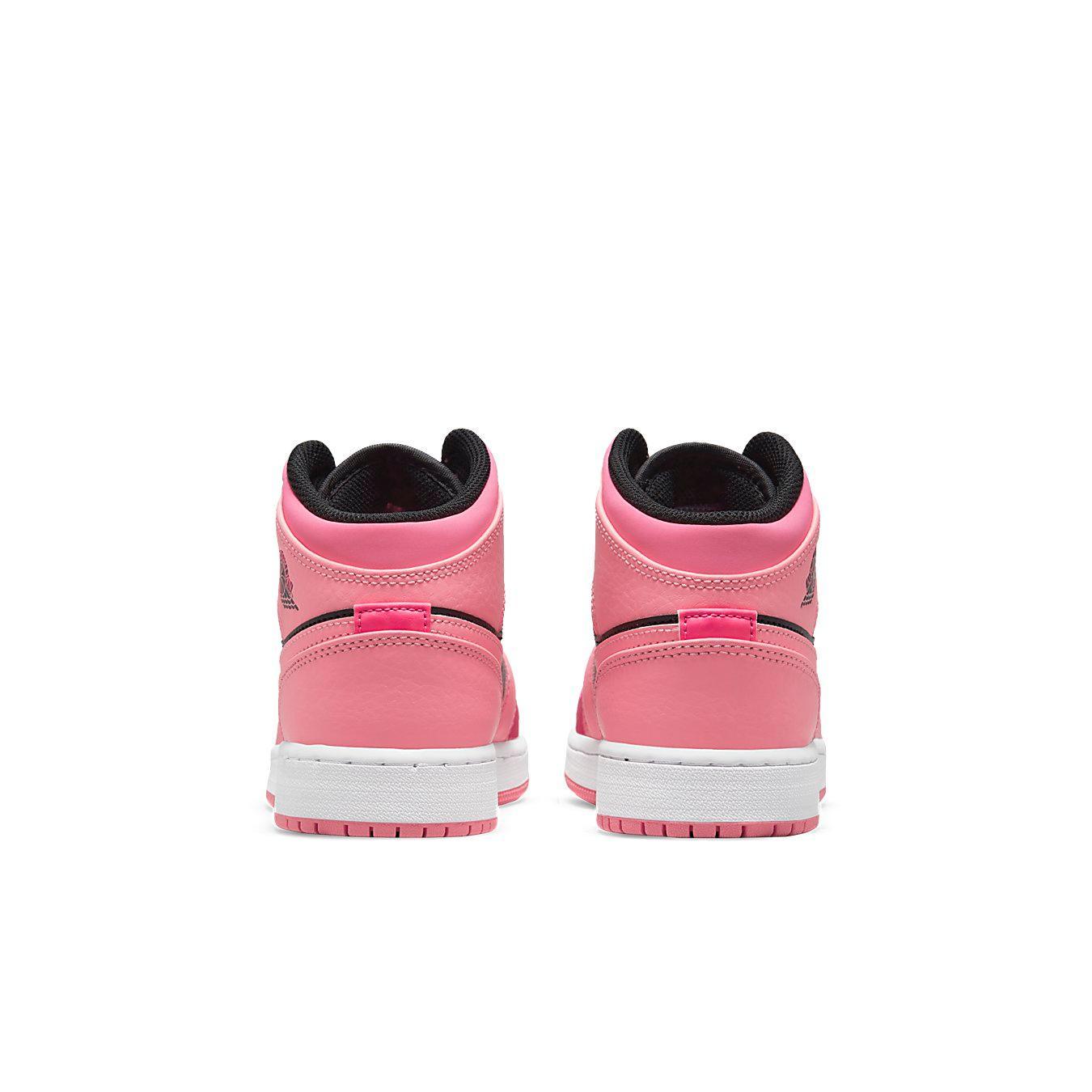 Rear view of the Air Jordan 1 Mid Coral Chalk (GS) in pink and black, featuring a white midsole.