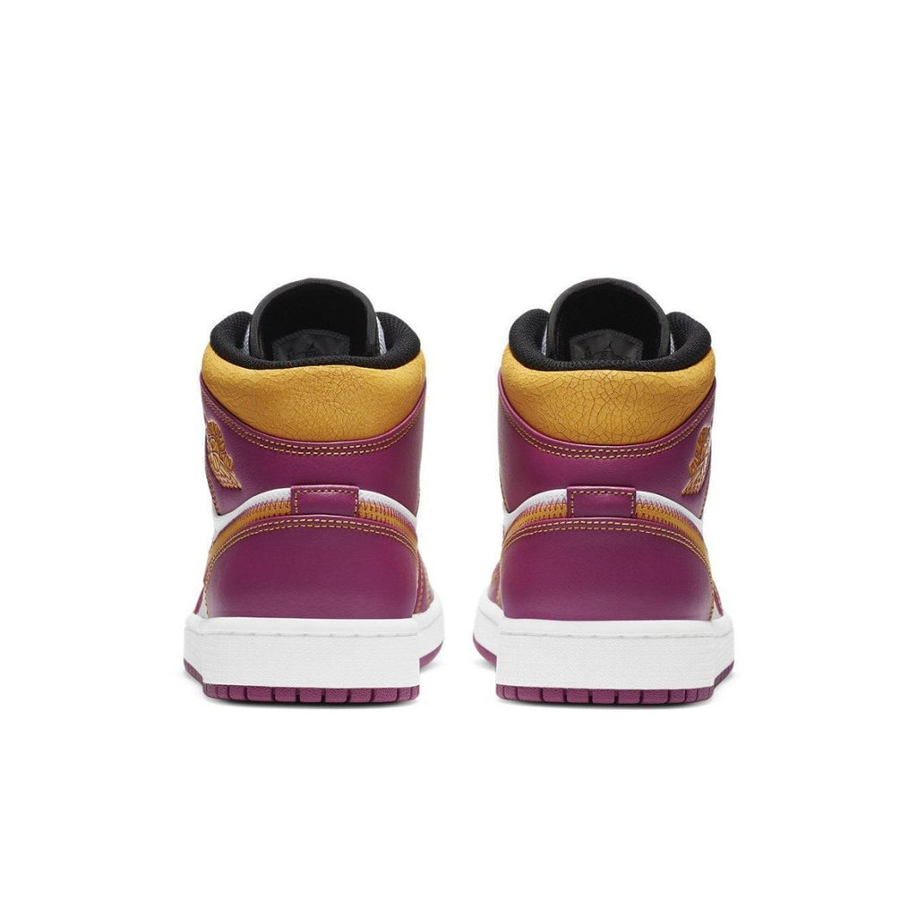 Back view of Air Jordan 1 Mid Dia de los Muertos with vibrant fuchsia and gold accents.