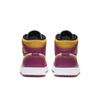 Back view of Air Jordan 1 Mid Dia de los Muertos with vibrant fuchsia and gold accents.