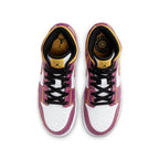 Top view of the Jordan 1 Mid Dia de los Muertos (GS) sneakers with vibrant magenta and white colors.