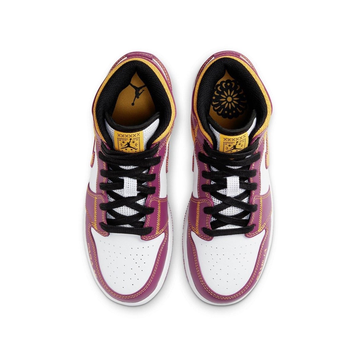 Top view of the Jordan 1 Mid Dia de los Muertos (GS) sneakers with vibrant magenta and white colors.