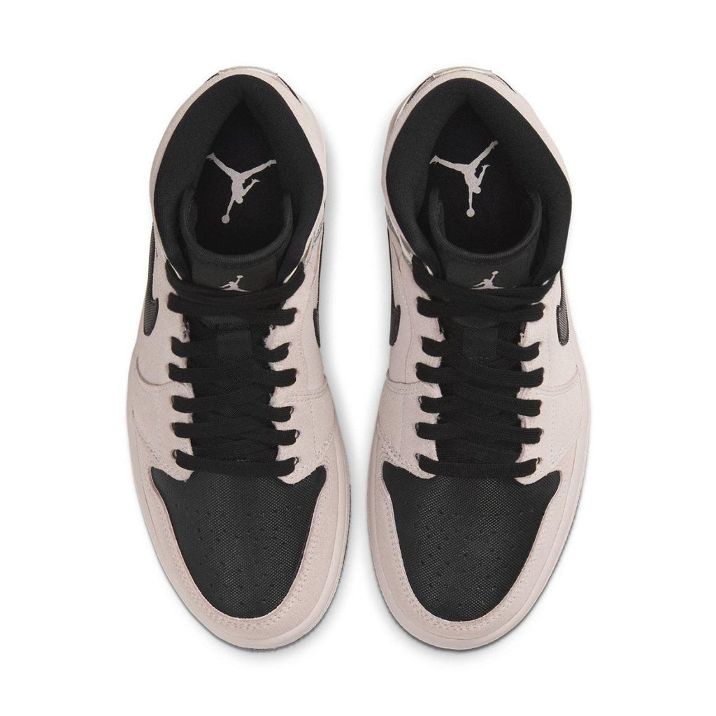 Jordan 1 Mid Dirty Powder Iridescent women's sneakers featuring pink and beige suede upper with black accents.
