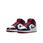 Air Jordan 1 Mid Gym Red Black Toe GS featuring leather upper and iconic Swoosh design.