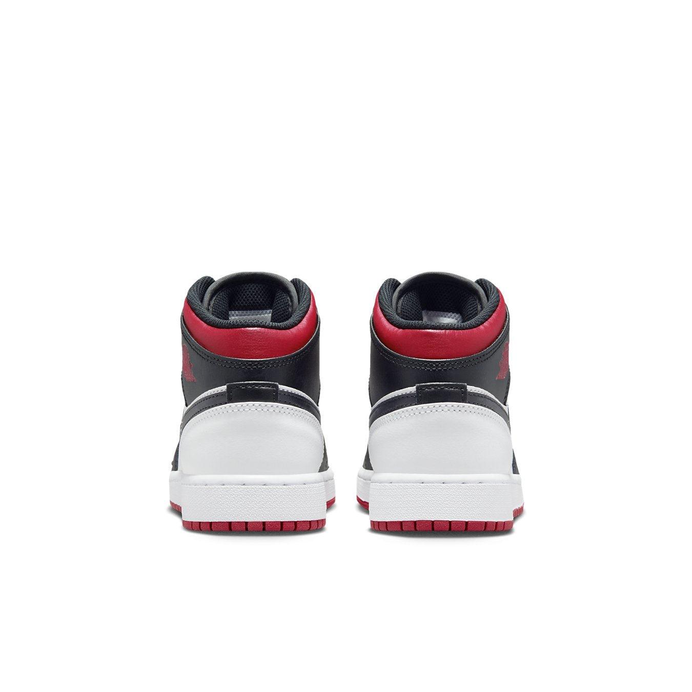 Air Jordan 1 Mid Gym Red Black Toe GS, rear view showcasing premium leather and iconic design.