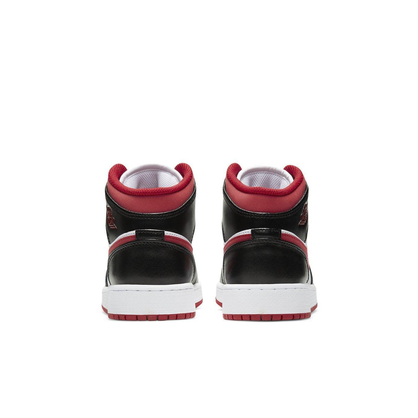 Rear view of Air Jordan 1 Mid Gym Red Black White sneakers showcasing stylish design.