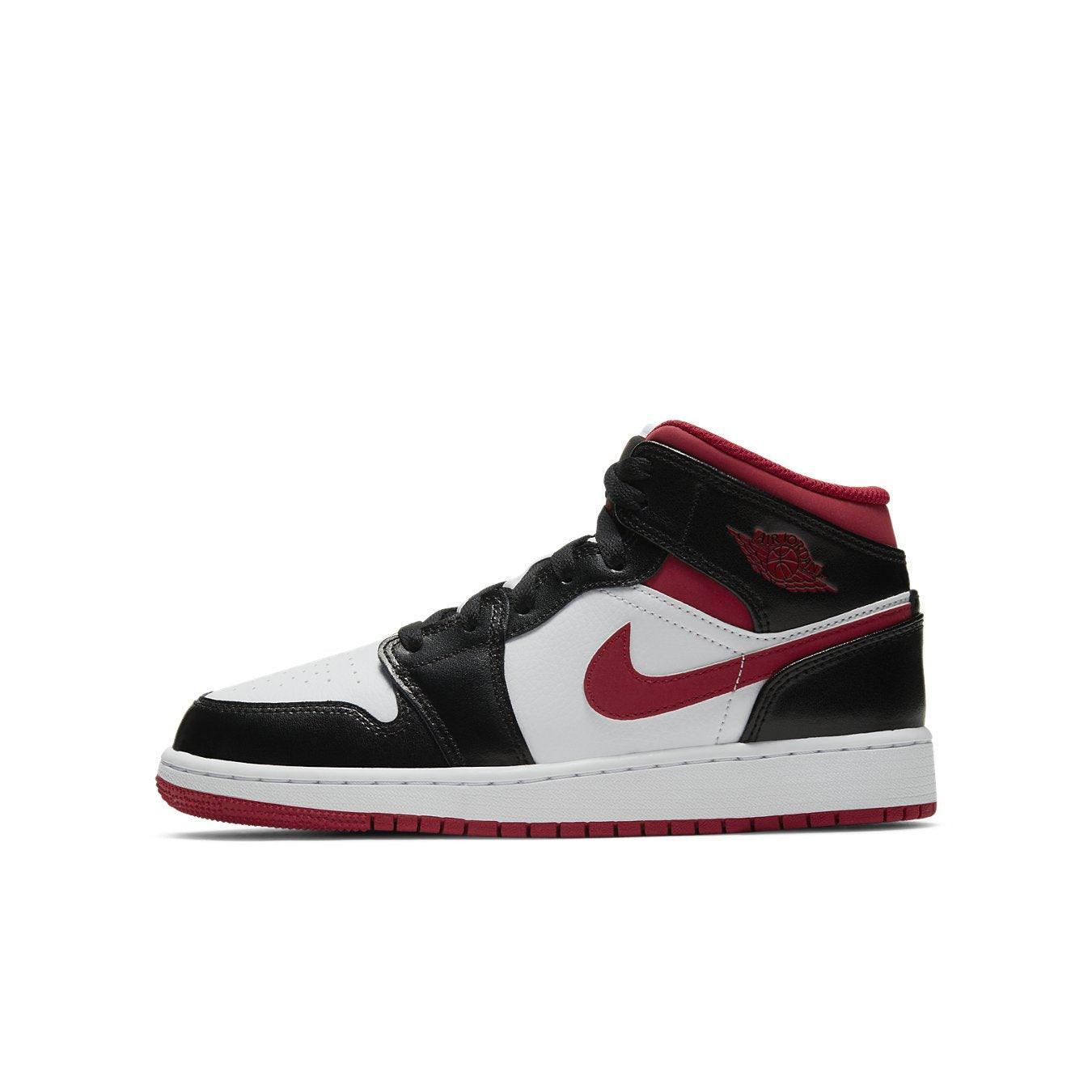 Jordan 1 Mid Gym Red Black White sneakers for kids with sleek design and stylish color accents.