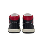 Rear view of Jordan 1 Mid Gym Red Panda sneakers showcasing black and red colorway and mid-top design.