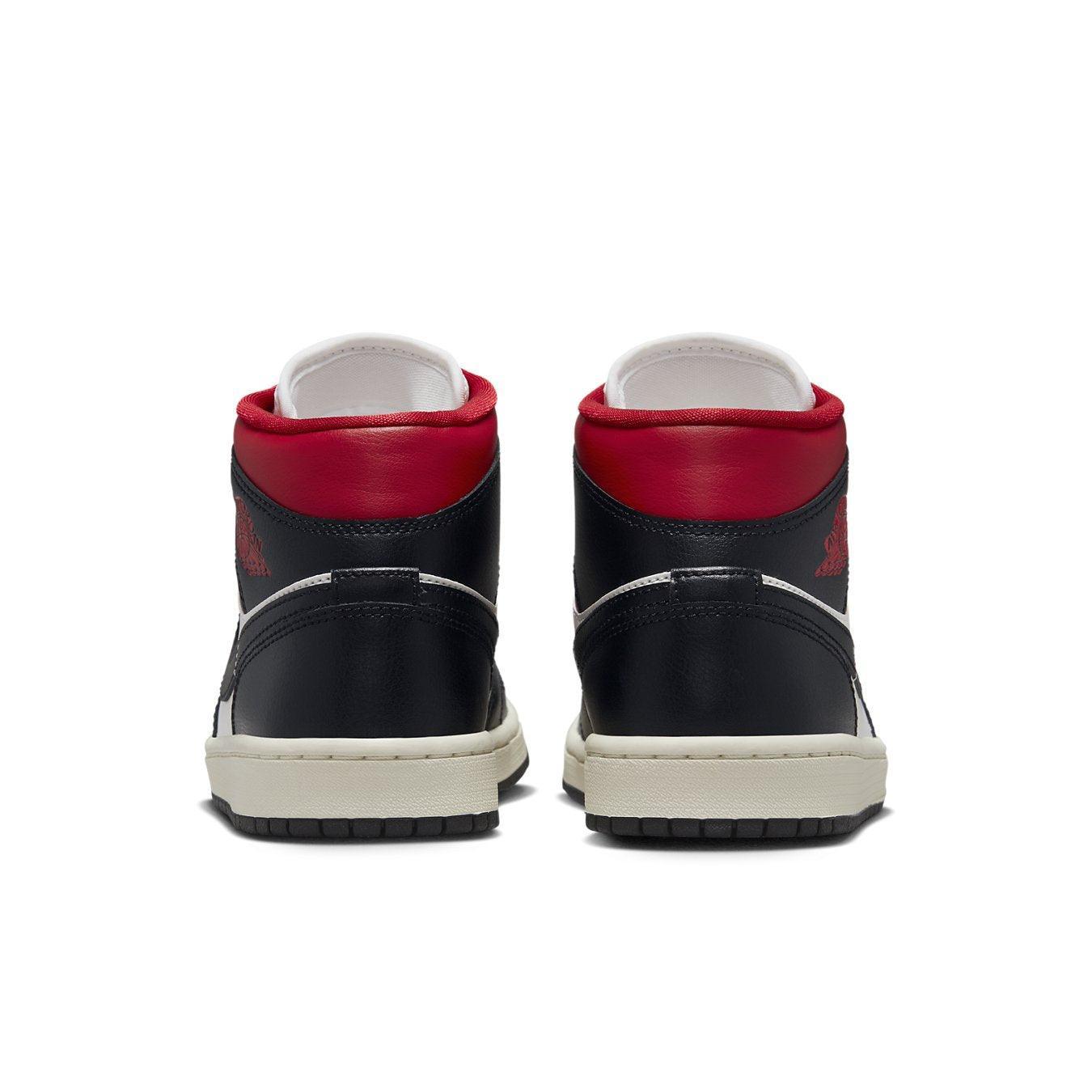 Rear view of Jordan 1 Mid Gym Red Panda sneakers showcasing black and red colorway and mid-top design.