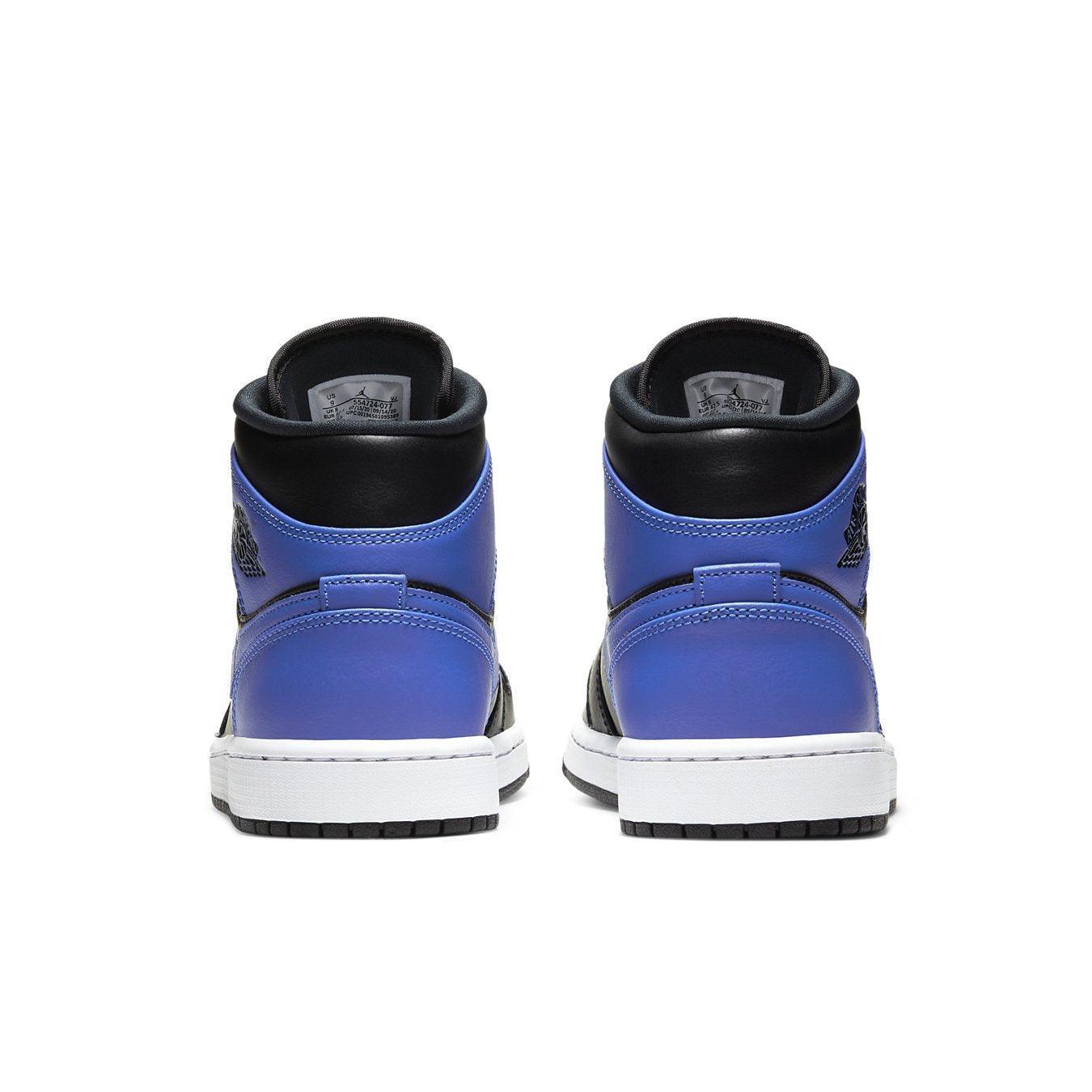 Jordan 1 Mid Hyper Royal Tumbled Leather sneakers rear view showcasing black, white, and Hyper Royal colorway.