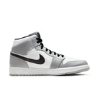 Air Jordan 1 Mid Light Smoke Grey sneaker showcasing a blend of white and grey leather with black accents.