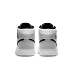 Back view of Air Jordan 1 Mid Light Smoke Grey sneakers showcasing sleek design and iconic logo.
