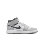 Air Jordan 1 Mid Light Smoke Grey GS sneaker in grey and white with black Swoosh and winter color scheme.