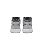 Back view of Air Jordan 1 Mid Light Smoke Grey (GS) showcasing grey leather and white midsole.