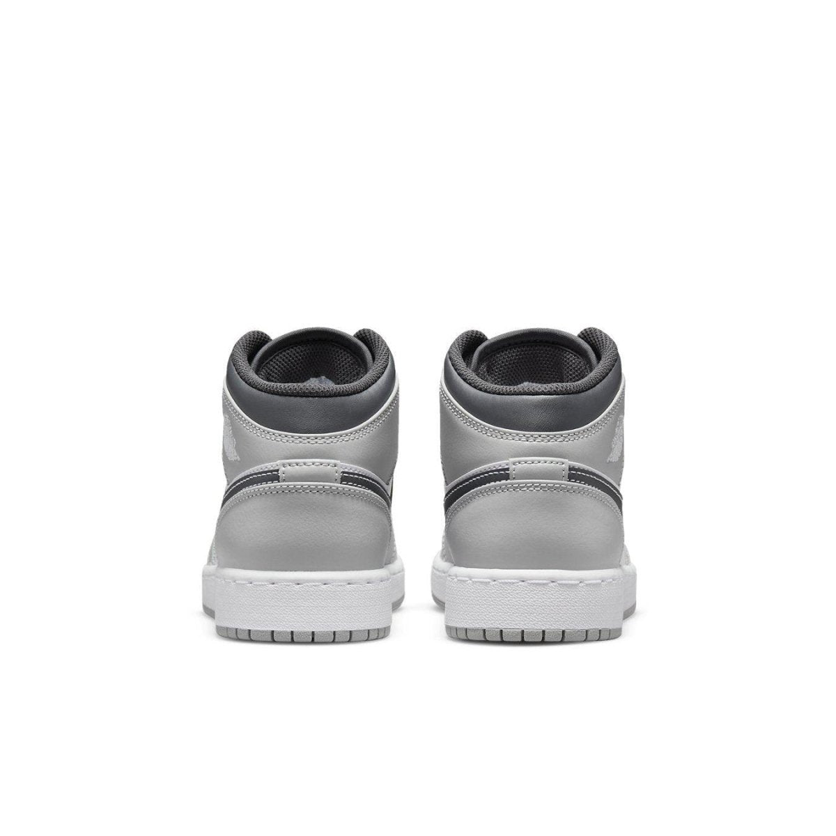Back view of Air Jordan 1 Mid Light Smoke Grey (GS) showcasing grey leather and white midsole.